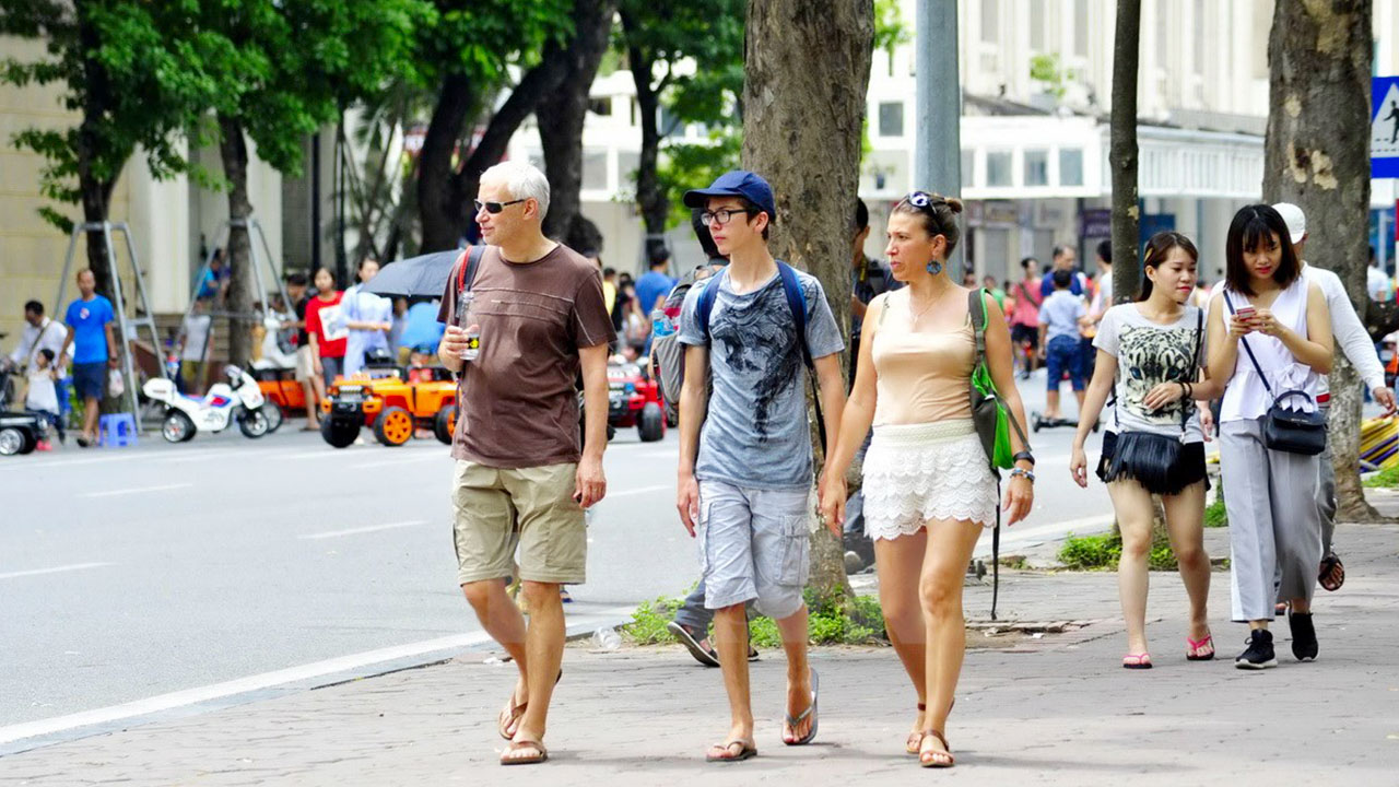 Tourists interact with locals