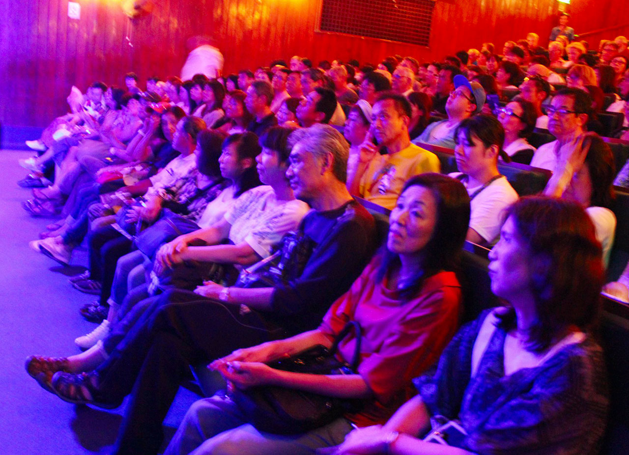 Audience enjoy water puppetry