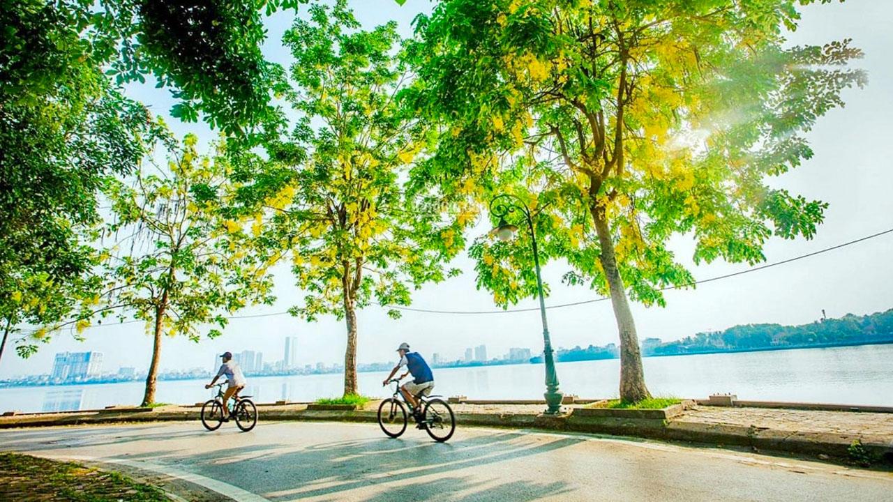 Cycling around West Lake Hanoi