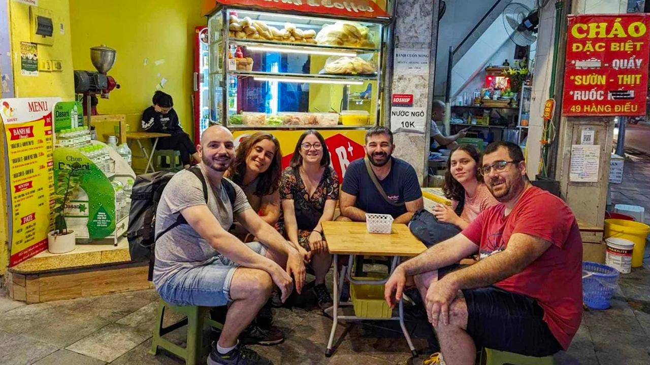 Tourists happily enjoy street food