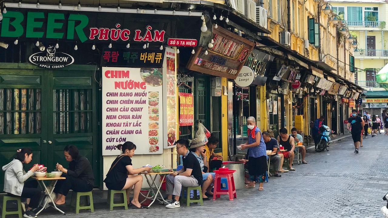 Vietnamese street food dishes served with beer on Ta Hien
