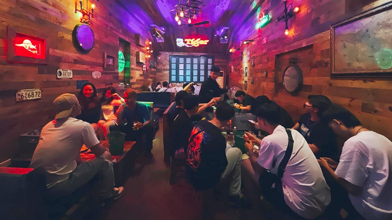 Prague Pub Ta Hien Street Hanoi with people enjoying drinks under warm lights