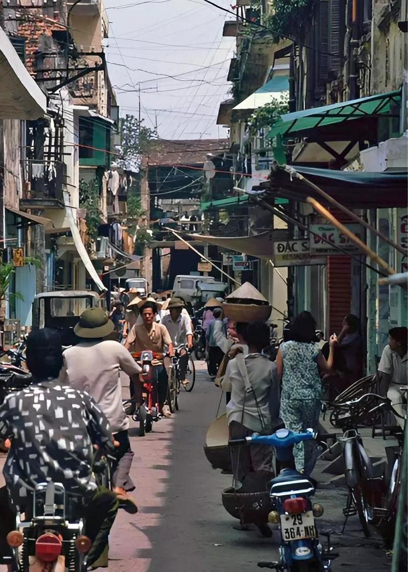 French colonial yellow buildings with wooden shutters in Hanoi Old Quarter